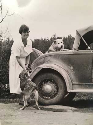 Louise at 33, Red Cross nurse in Bonfield, northern Ontario, with sled dog